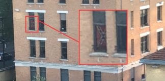 Paris - un drapeau confédéré symbole de racisme accroché à la fenêtre d’une caserne de police